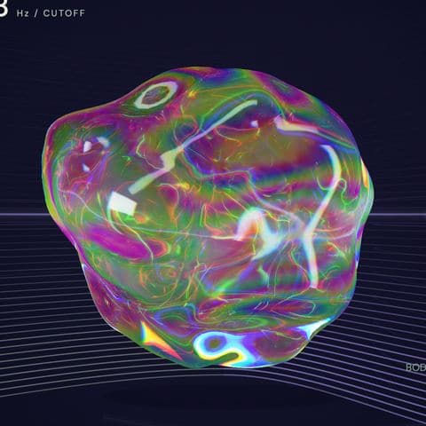 The orb in Lucy: a lumpy, oil-slick sphere in shifting magenta, green and gold.