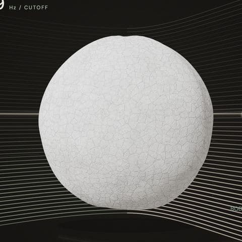 The orb in Stonemilk: a white sphere set hard, its surface cracked into small plates.
