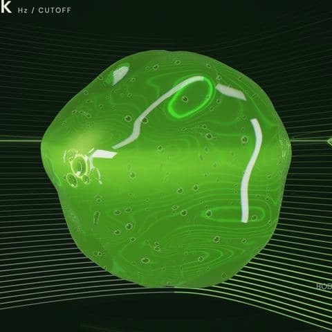 The orb in Venom: a glossy acid-green body with bright streaks across it.